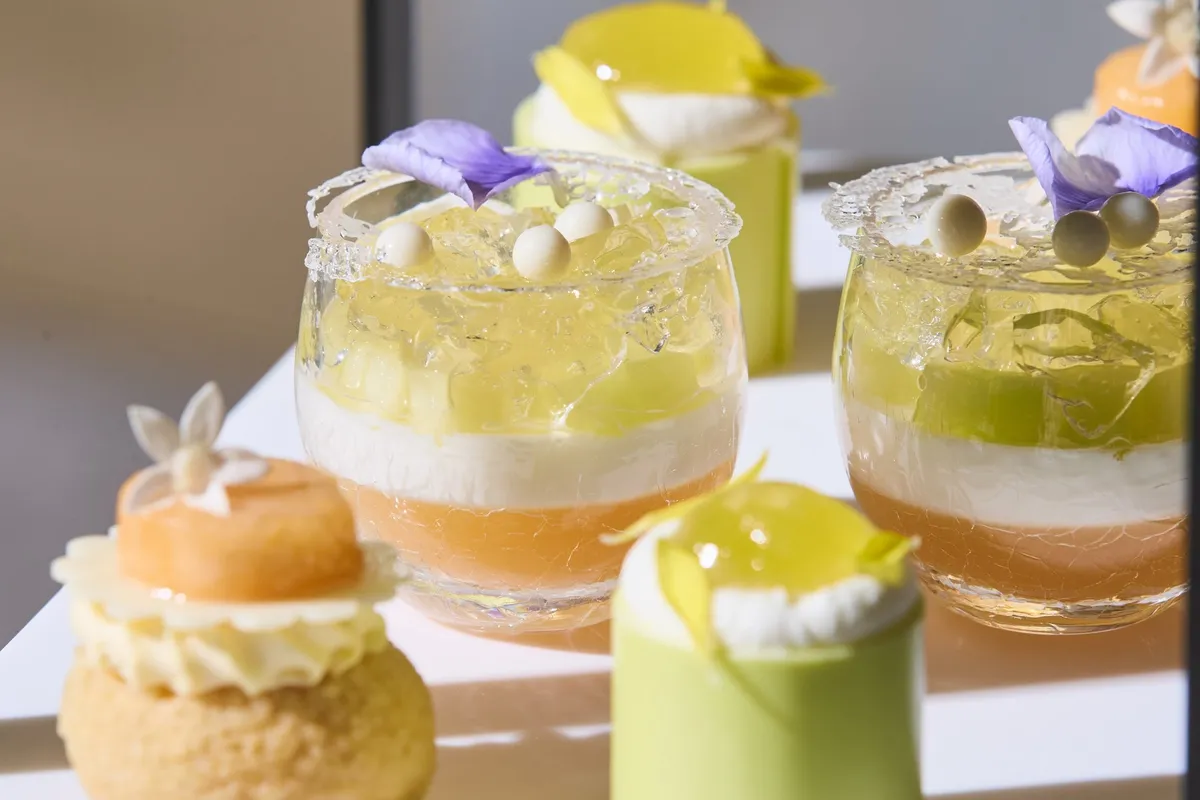 Layered melon and jelly desserts in small glasses