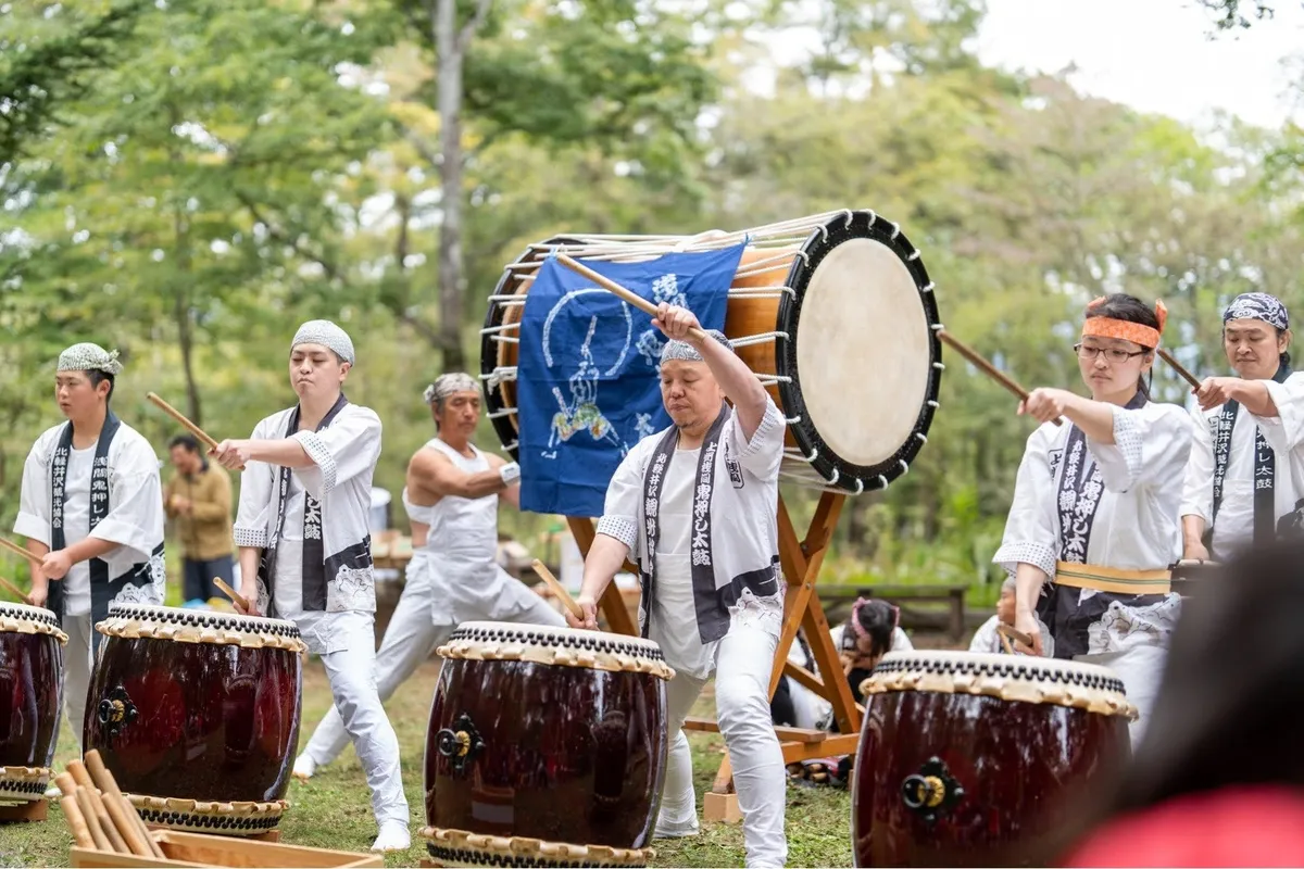 Traditional taiko drumming performance outdoors