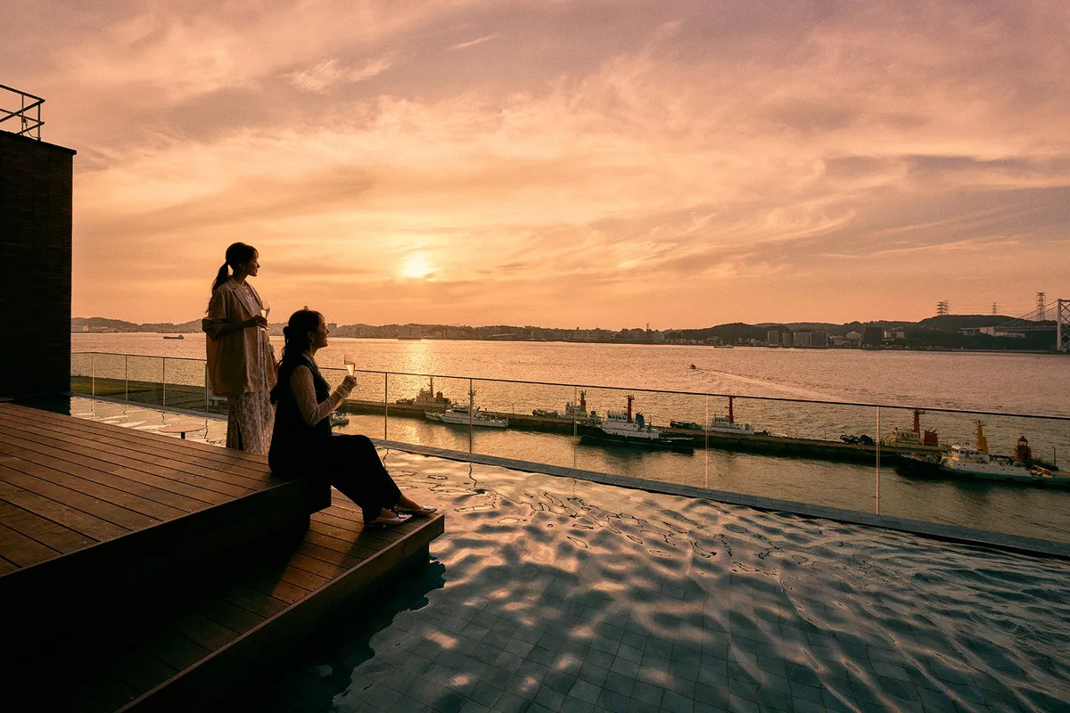 Guests enjoying the golden hour on the rooftop terrace