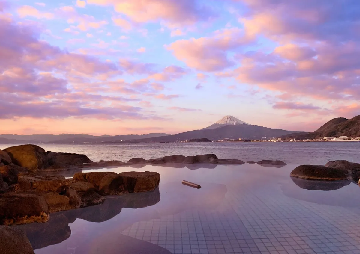 Open-air bath with a view of Mount Fuji at sunset