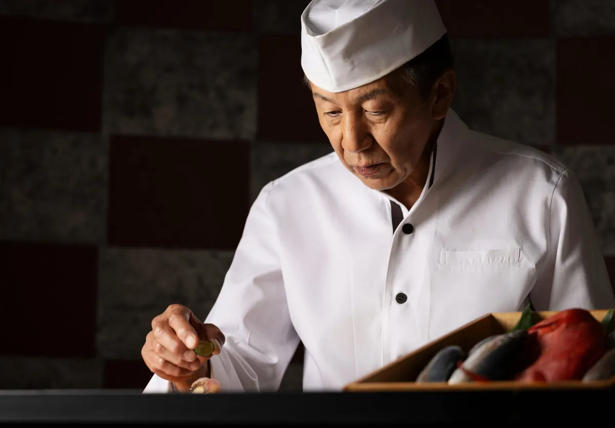 A sushi chef preparing seafood at Hotel Granvia Kyoto
