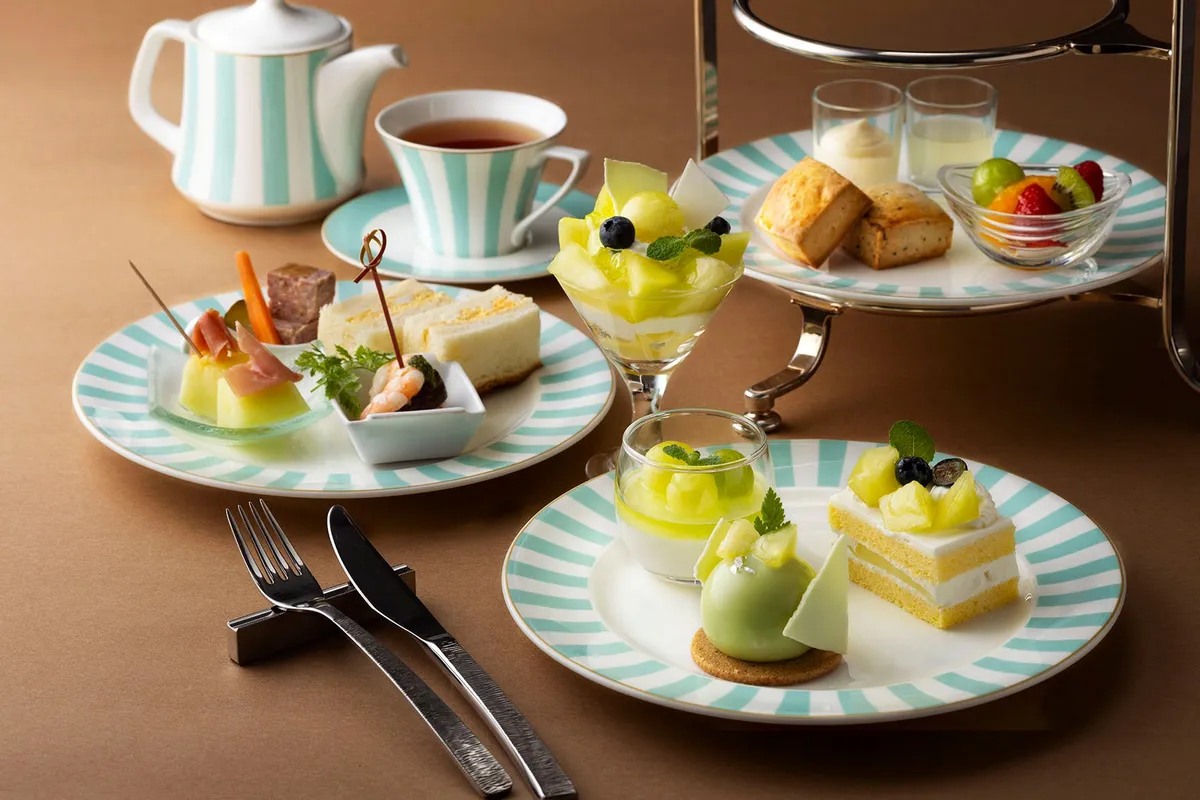 Full afternoon tea set with tiered stand and teapot