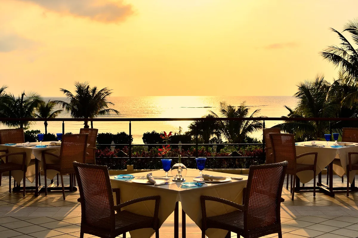 Sunset dining tables overlooking the ocean
