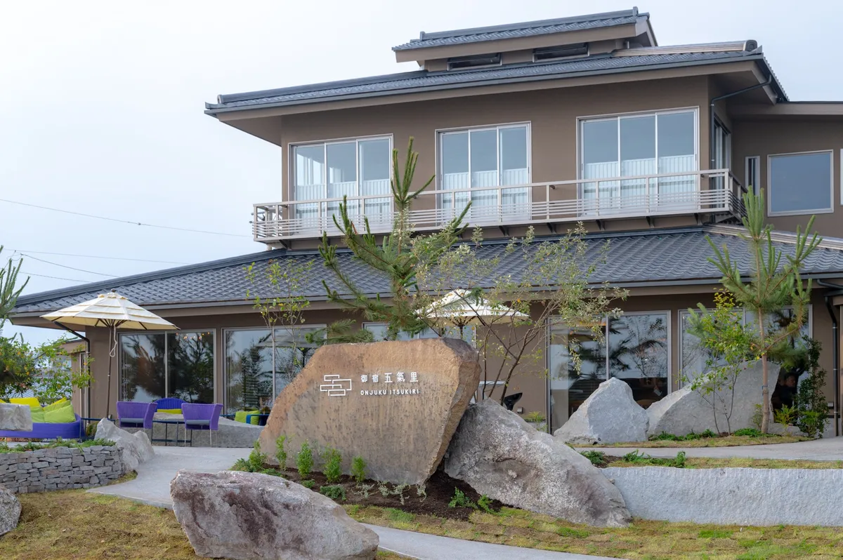 The modern Japanese exterior of Onjuku Itsukiri featuring traditional tile roofing.