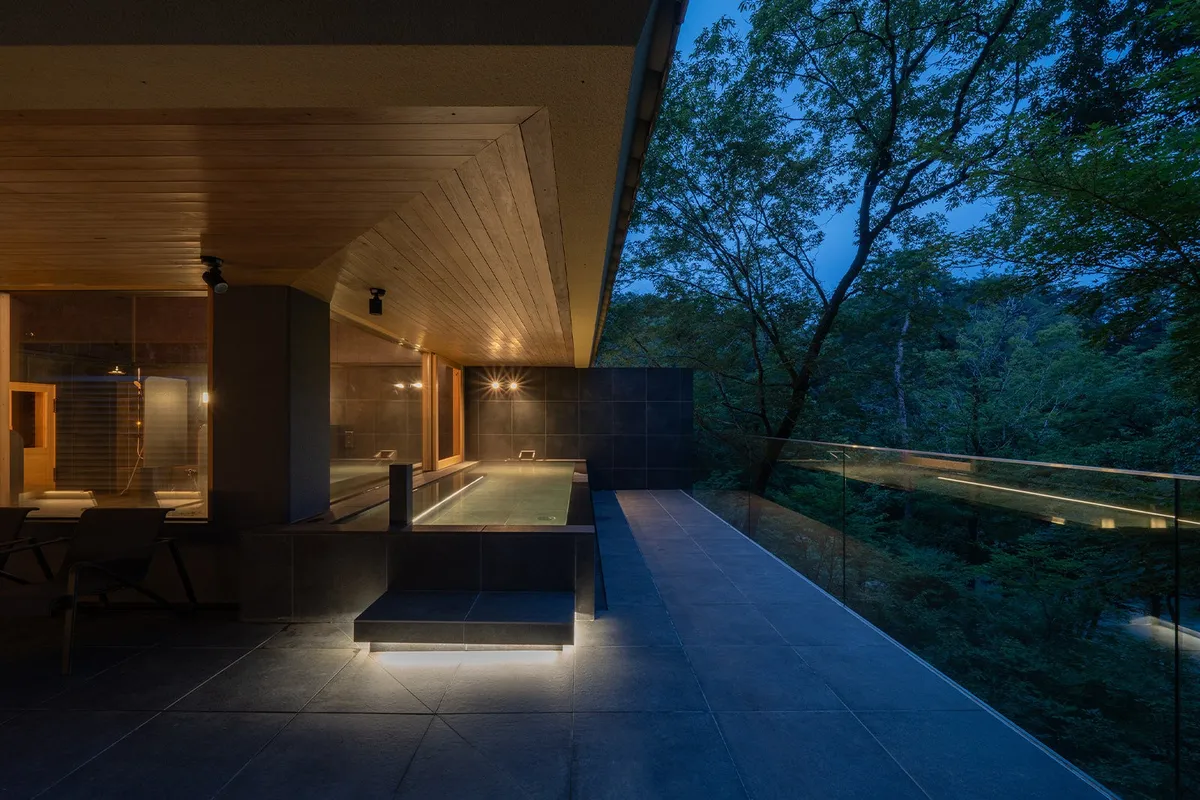 The communal bath at dusk with integrated lighting