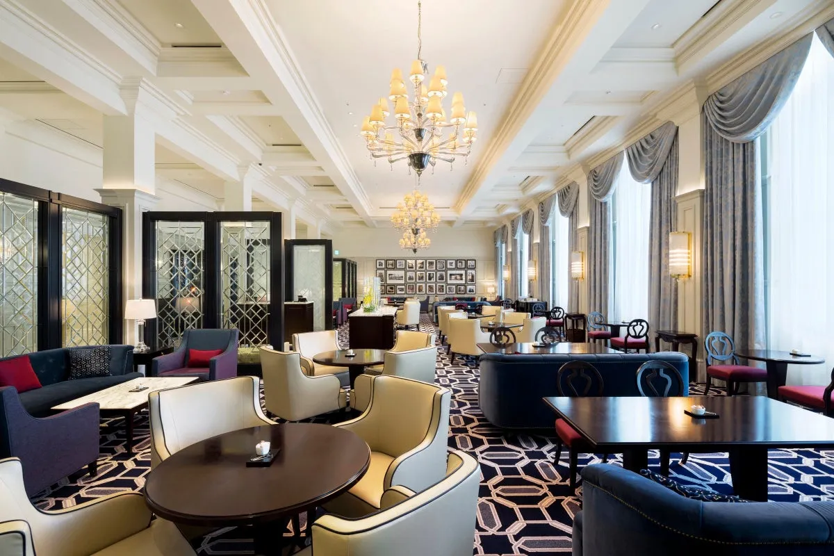 Interior of The Lobby Lounge with high ceilings and chandeliers