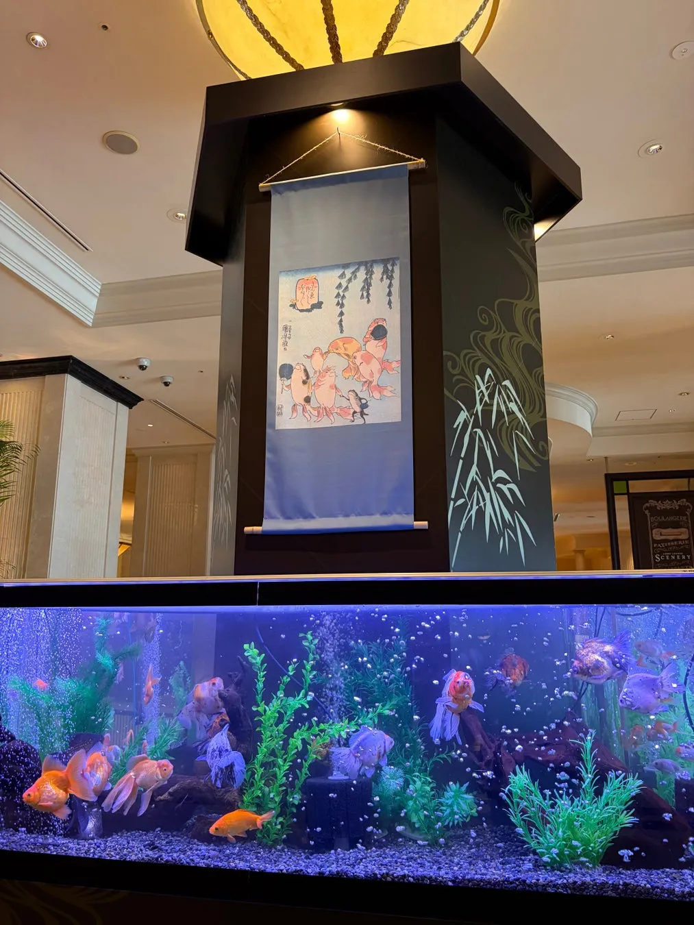 Ukiyo-e scroll hanging above the goldfish tank