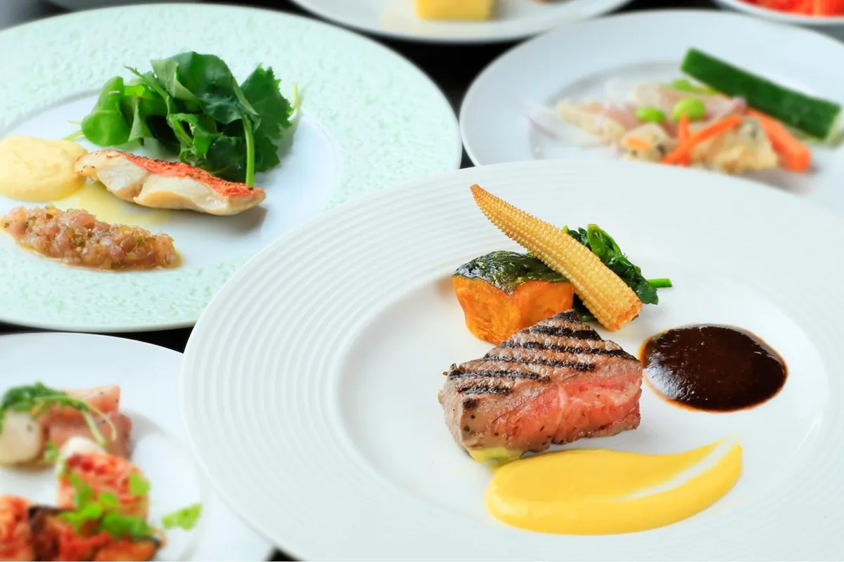Plated French cuisine featuring grilled beef