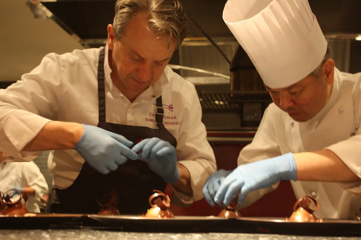 Chef Bragagnolo preparing dishes in the kitchen