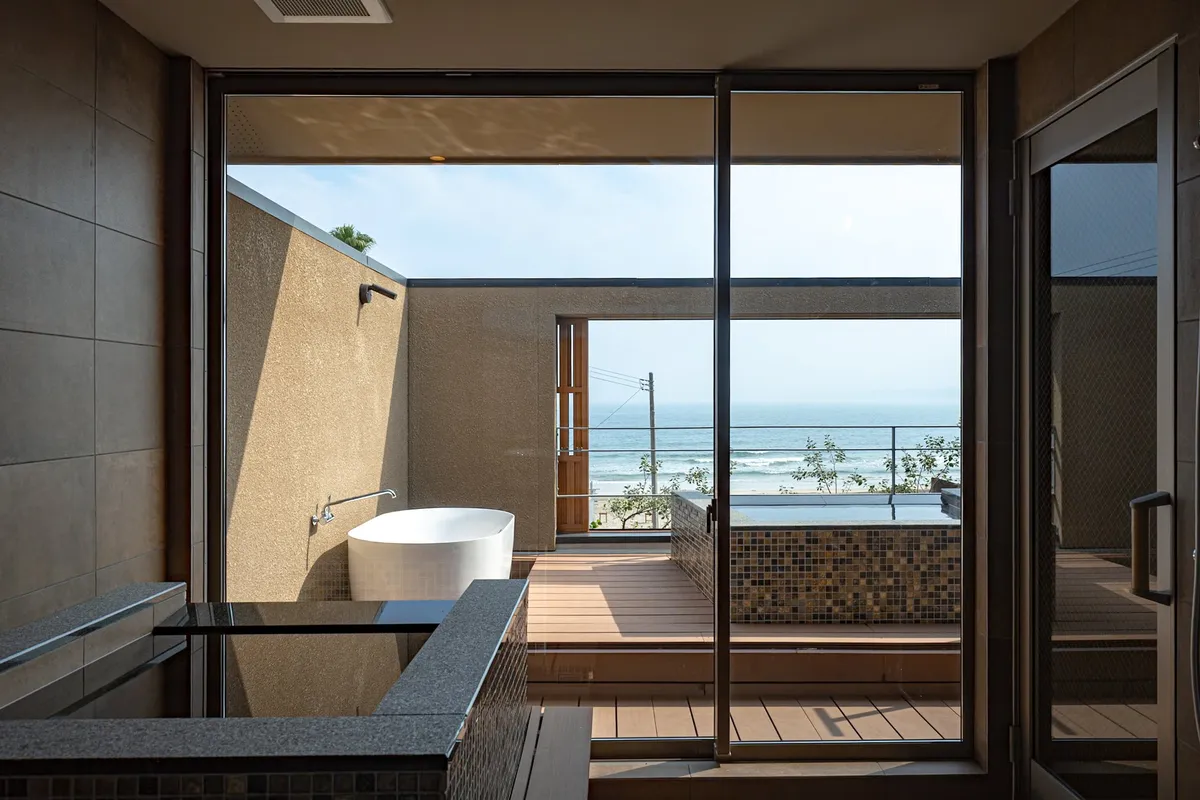 A private natural onsen with views of the Chiba shoreline.
