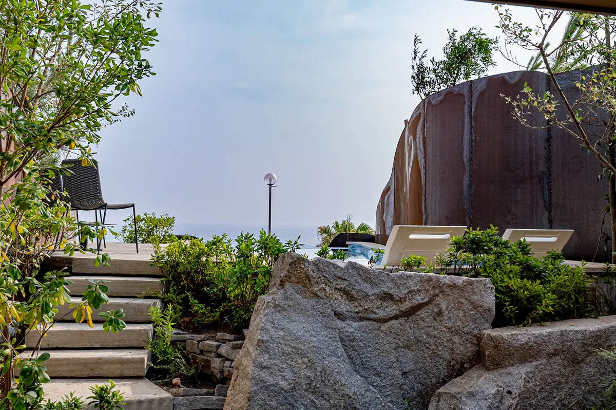Stone masonry and steps leading to the villa's outdoor terrace.