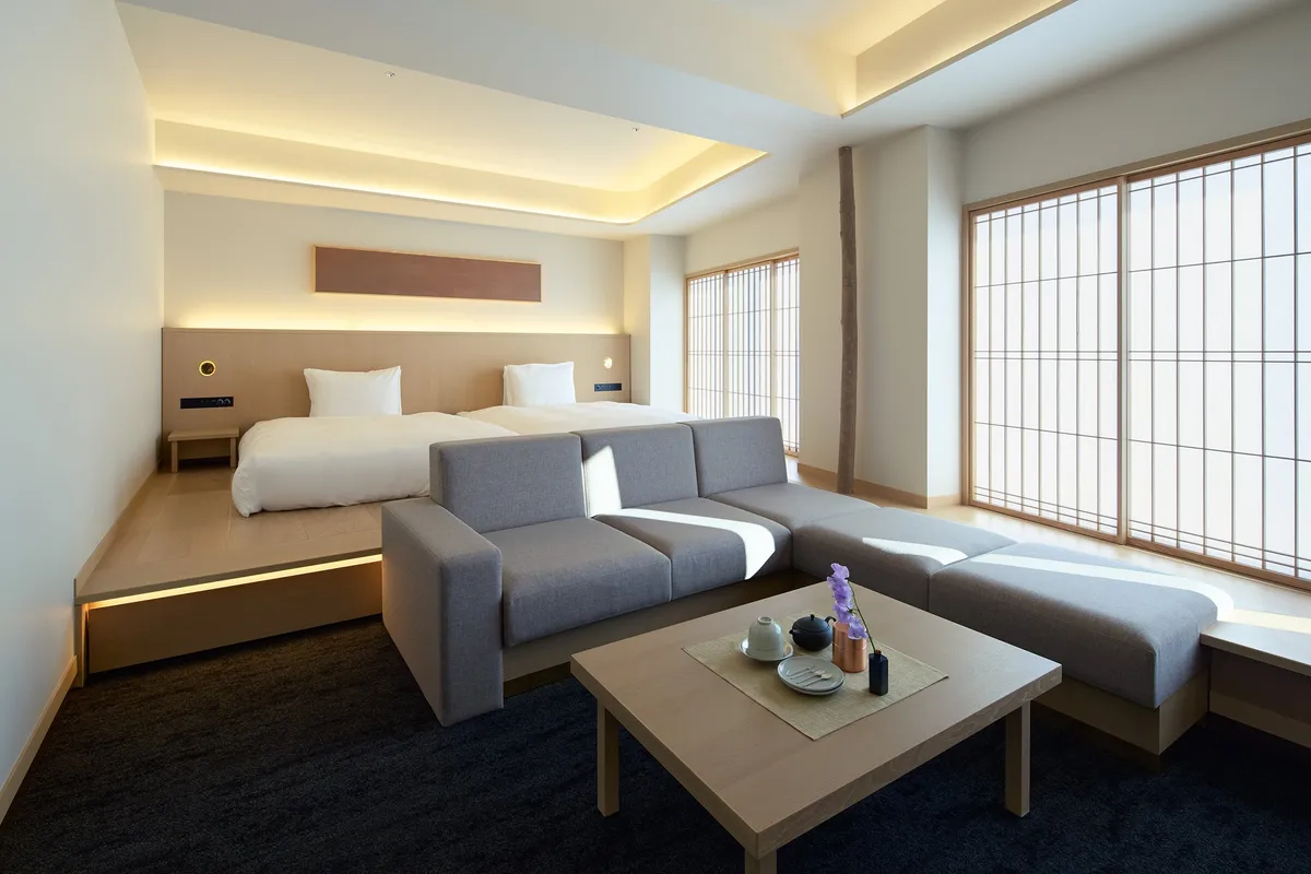 A guest room featuring shoji screens and a seating area