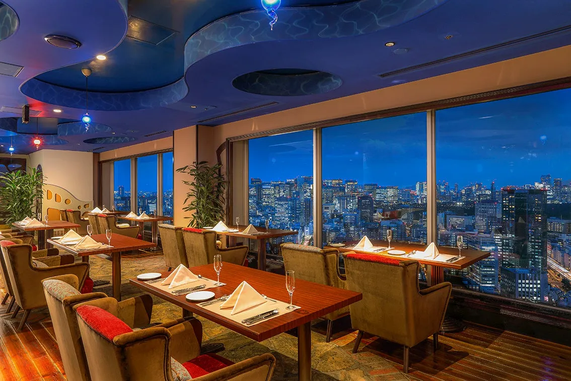 Lounge interior of Artist Cafe with city skyline views
