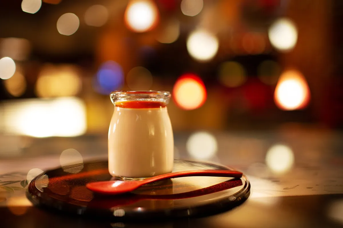 A small jar of Kaga pudding on a lacquer tray