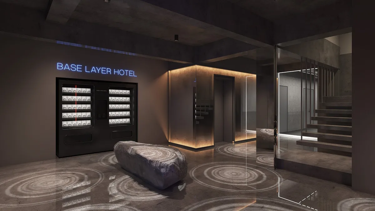 Minimalist hotel lobby with neon signage and stone seating