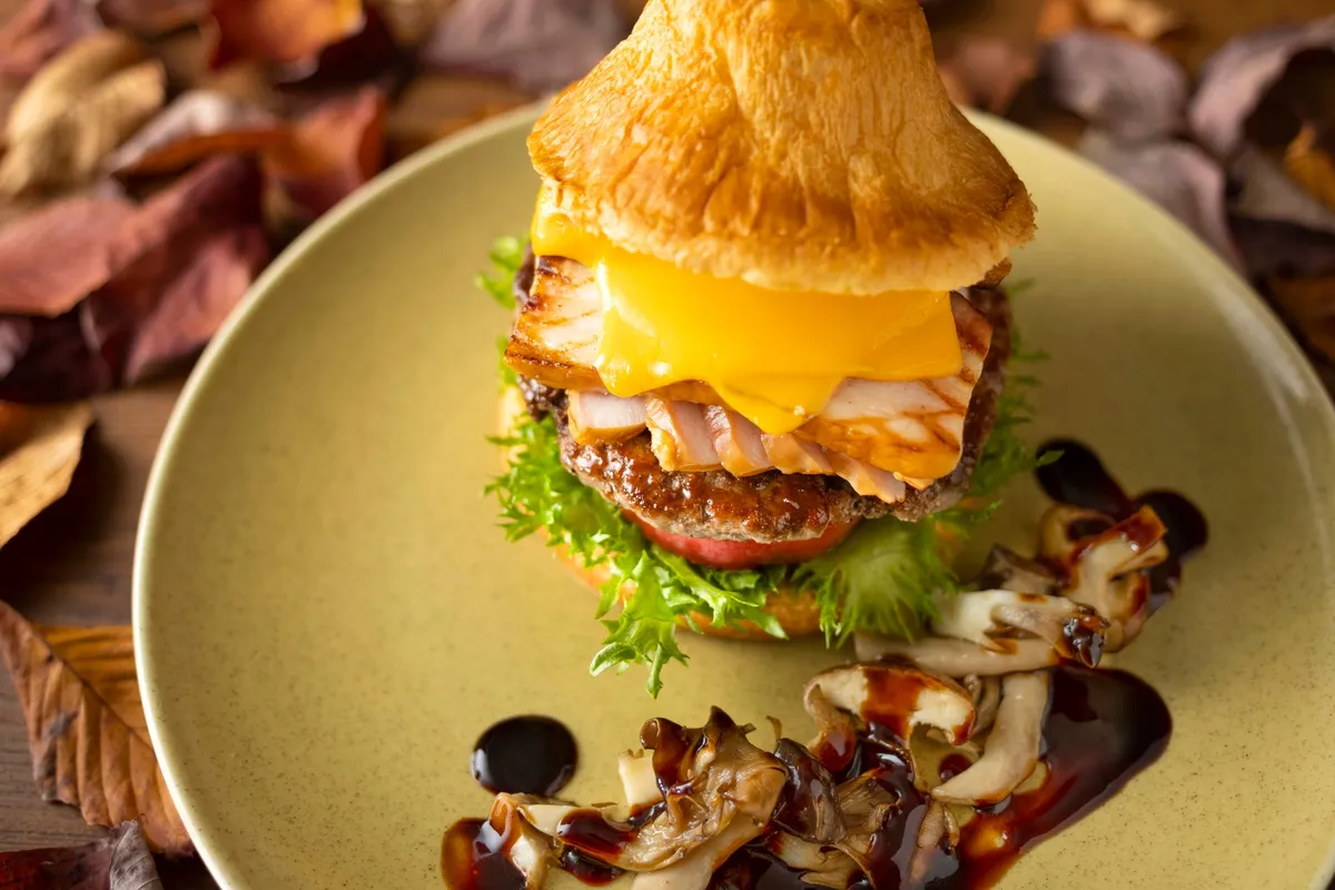 The Mt. Fuji Triple Meat Burger served with mushrooms and wine-based sauce