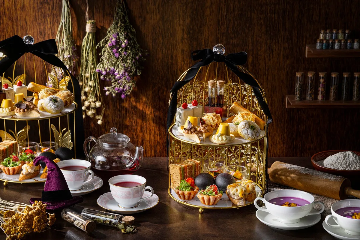 Full afternoon tea spread with wizard motifs