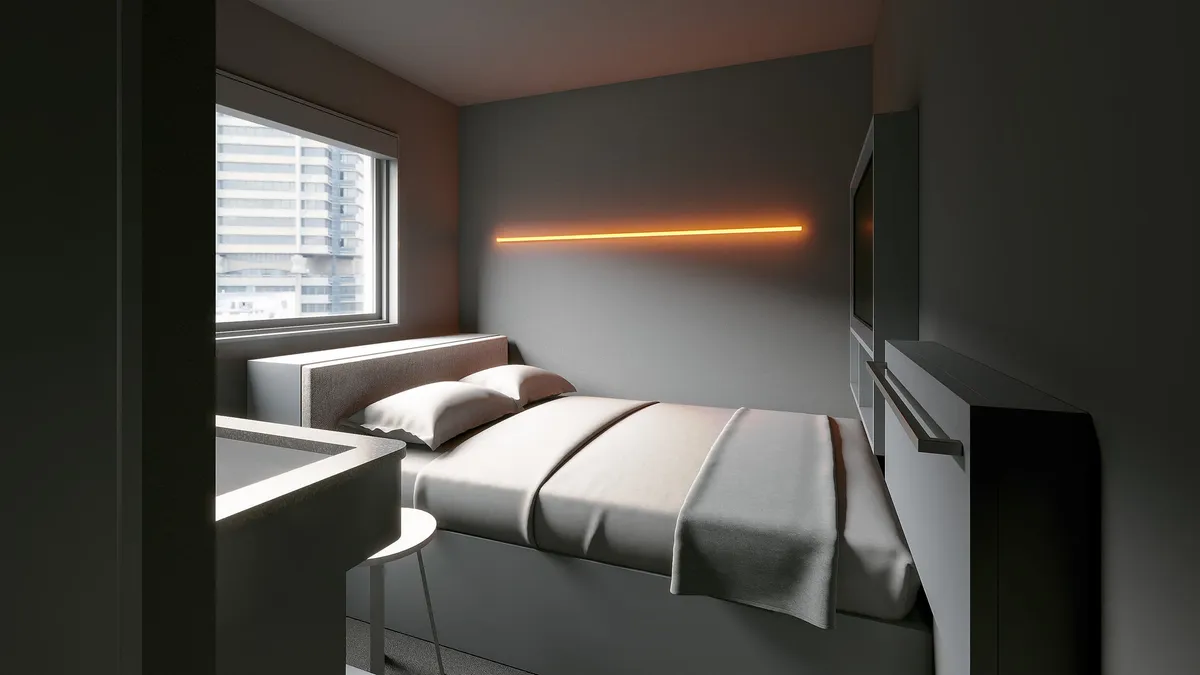 Minimalist guest room with grey walls and orange neon light