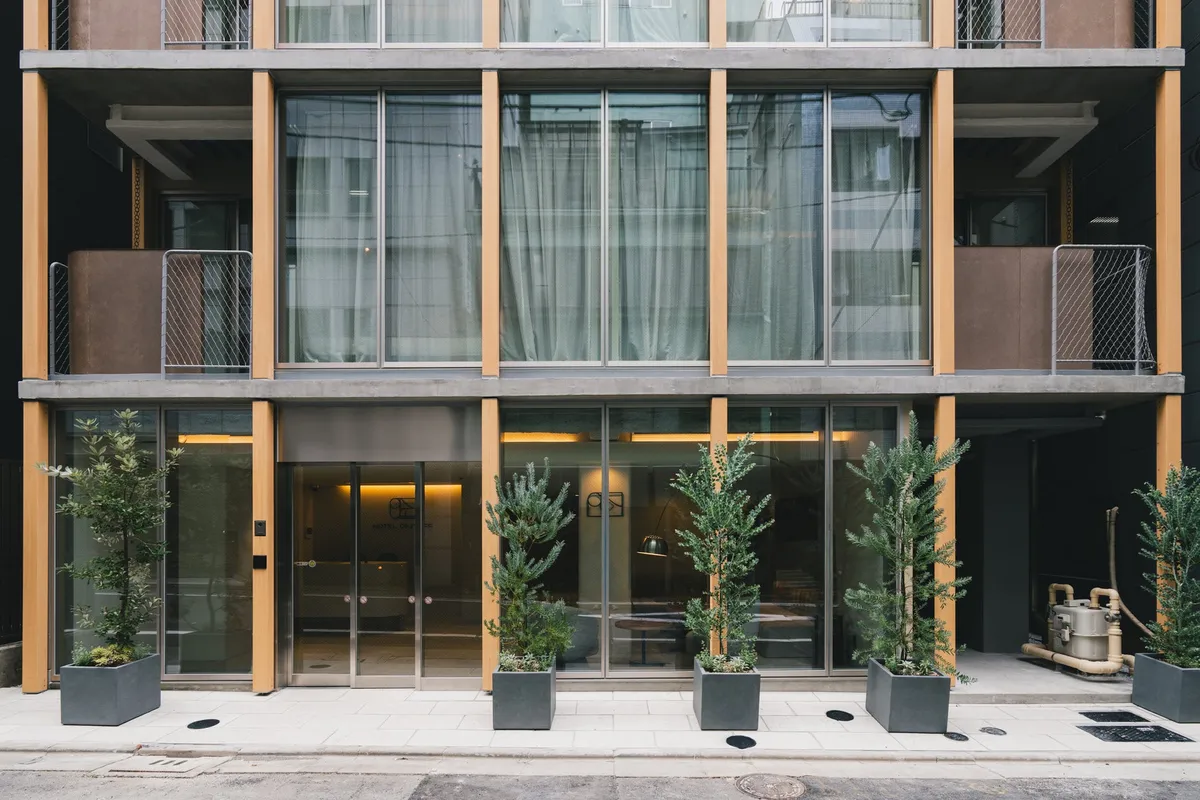 Exterior view of the modern hotel building in Shintomicho