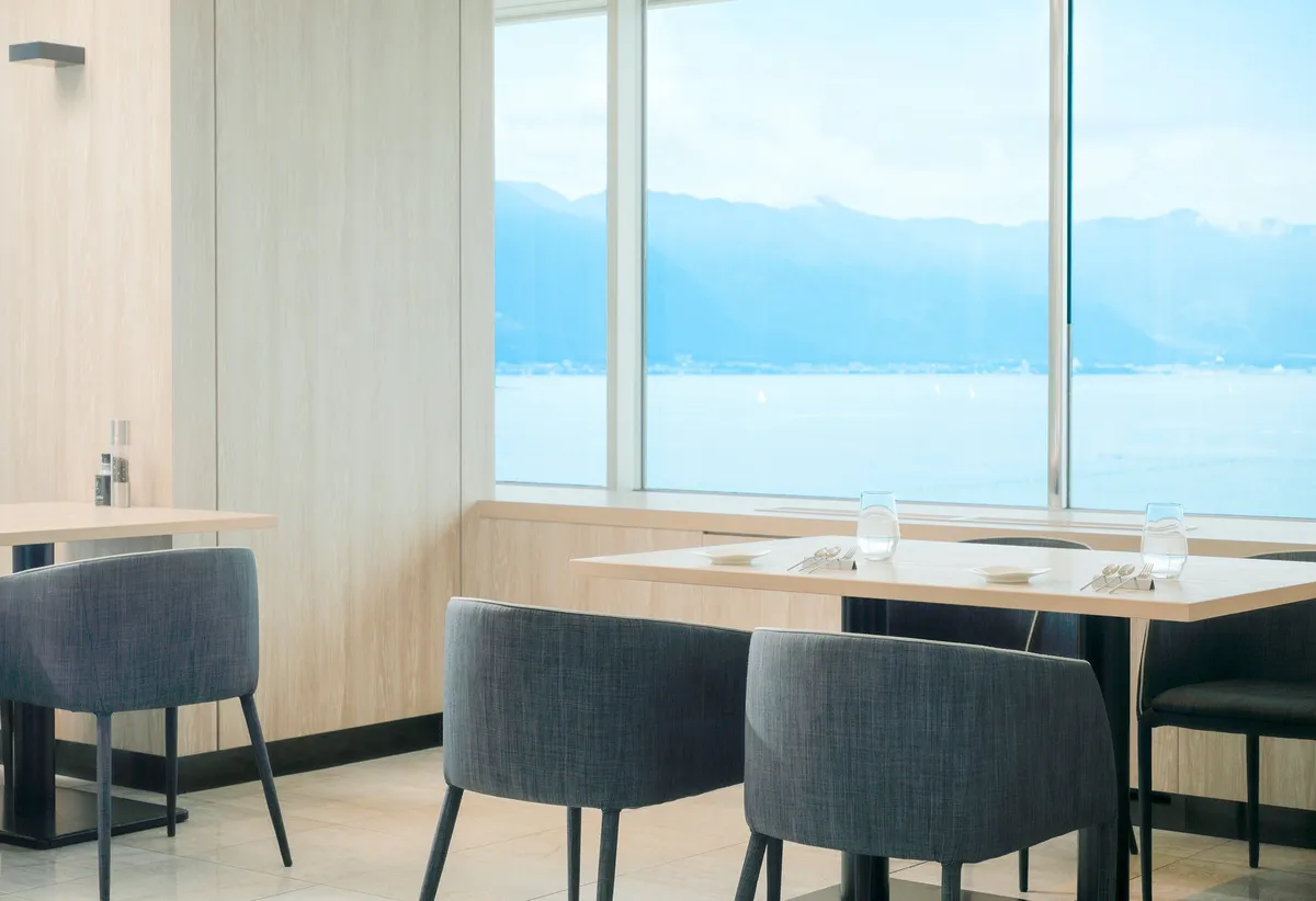 The interior of Grill & Dining G with large windows overlooking Lake Biwa.