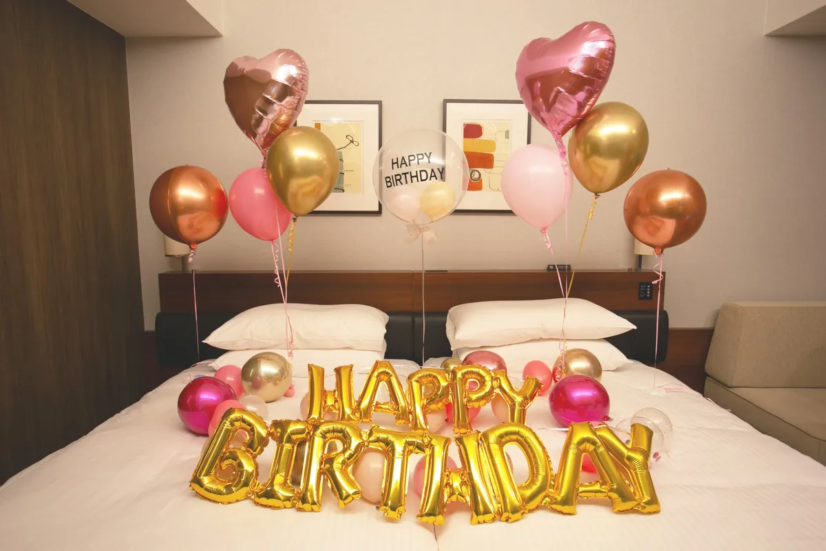 Pink and gold birthday balloon setup