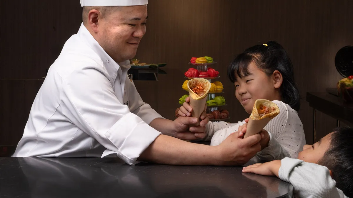 Chef serving children