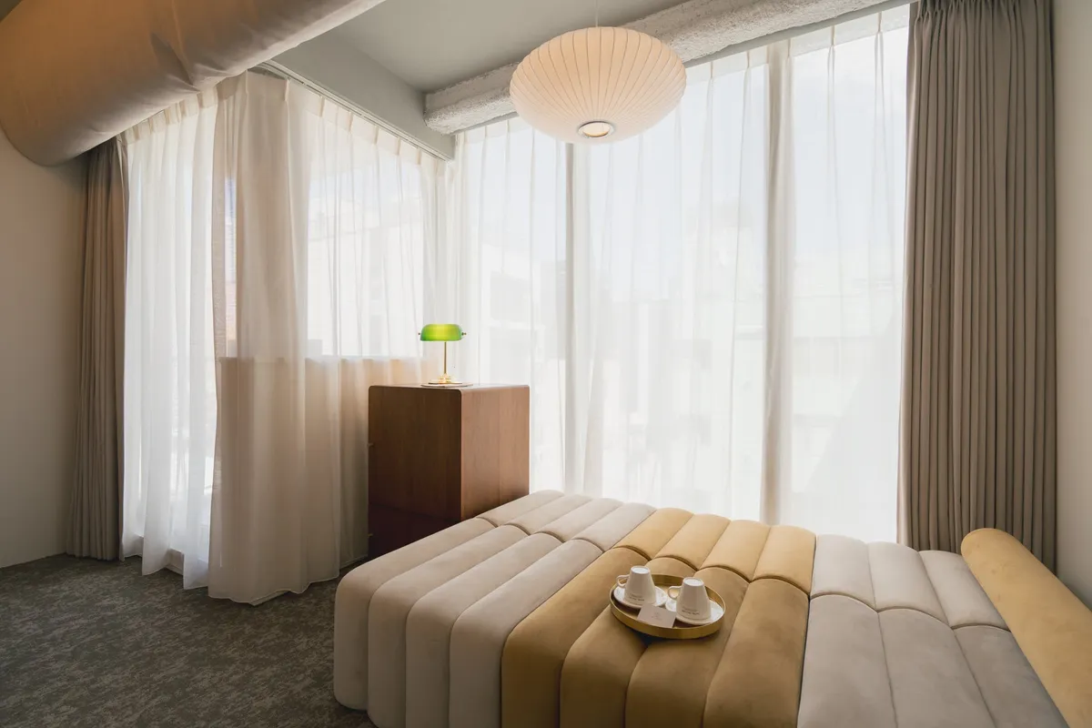 Room detail showing a minimalist sofa and tea set
