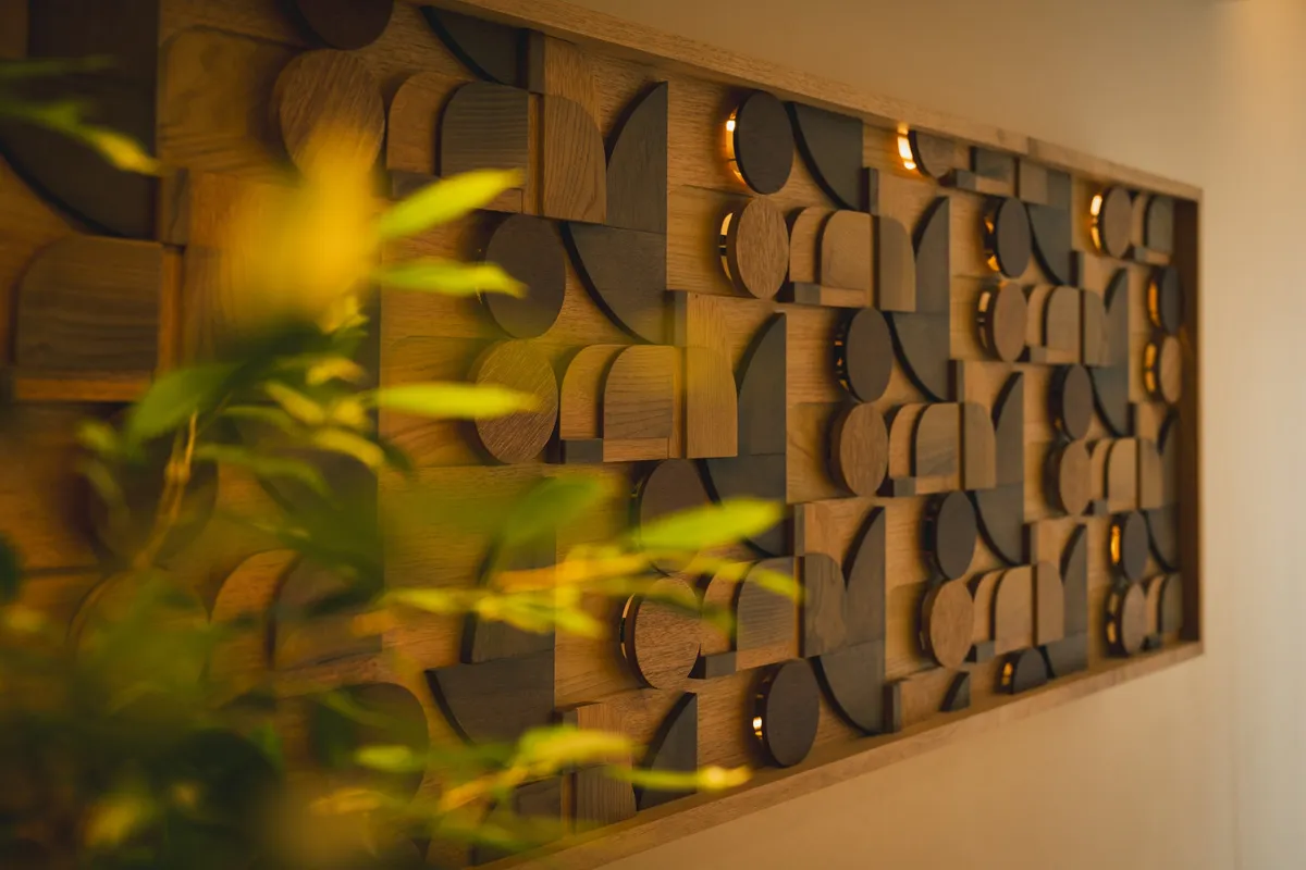 Close-up of wood-relief wall art with backlighting
