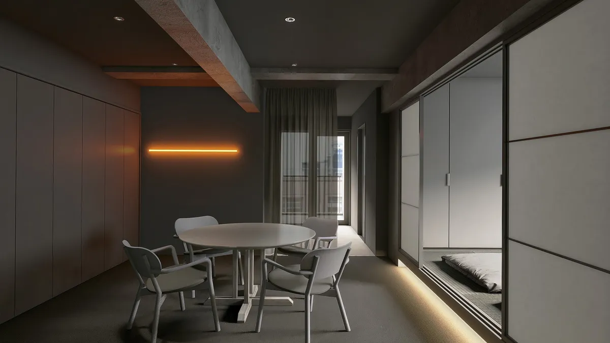 Spacious hotel suite with dining table and tatami area