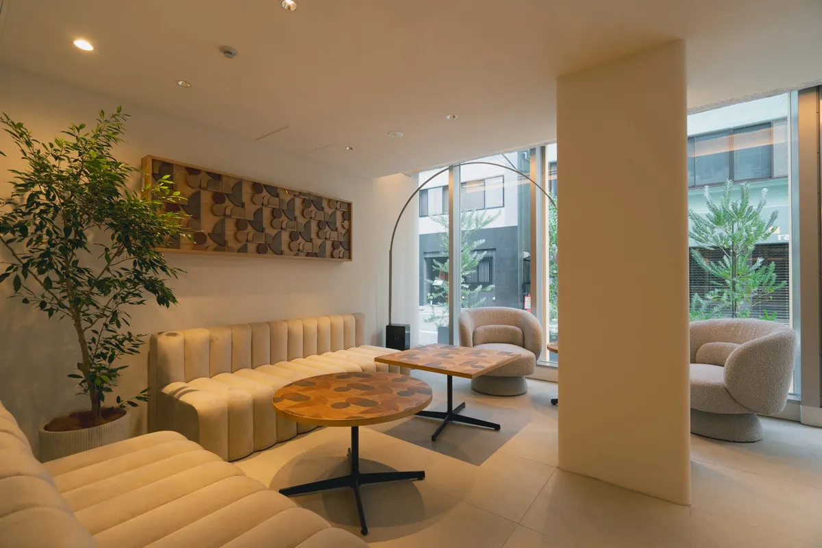 Lobby lounge with curved furniture and wood art