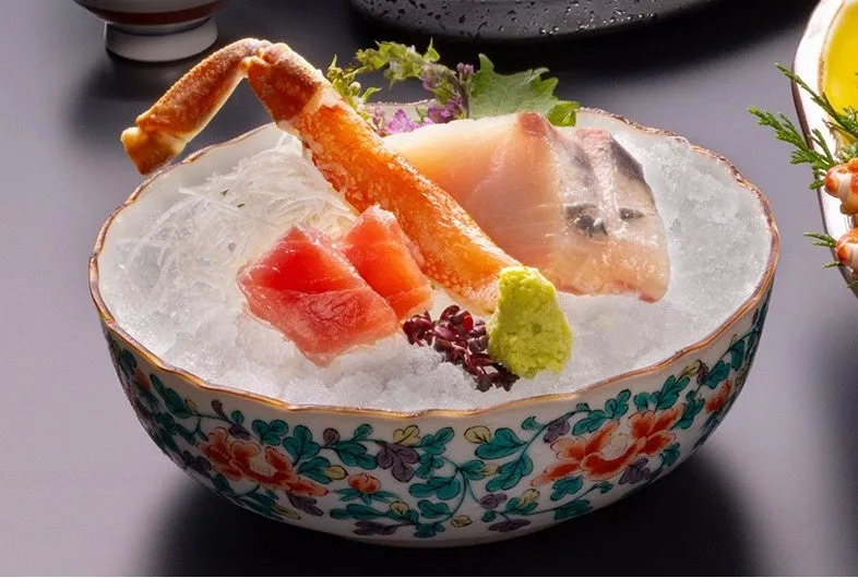 Crab and tuna sashimi served in a decorative bowl